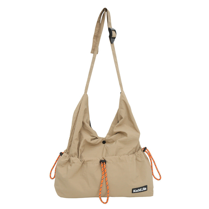 Z25030930日系輕便休閒斜背包女新款通勤單肩包抽繩工裝包