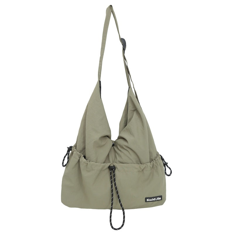 Z25030930日系輕便休閒斜背包女新款通勤單肩包抽繩工裝包